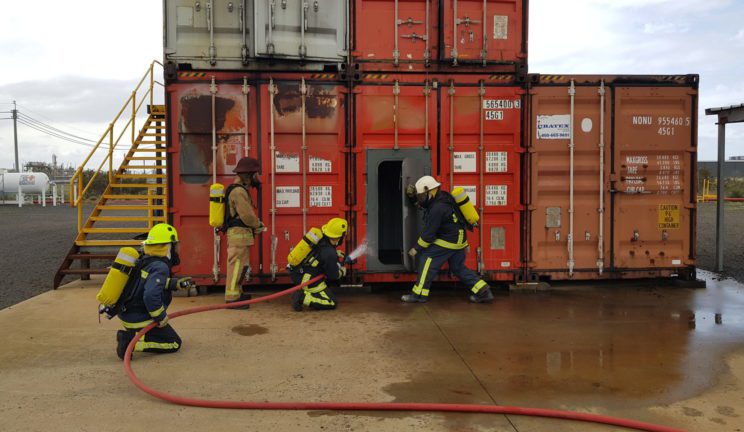 Personnel learning the STCW standards for fire prevention and firefighting at sea as part of the Certificate of Safety Training course